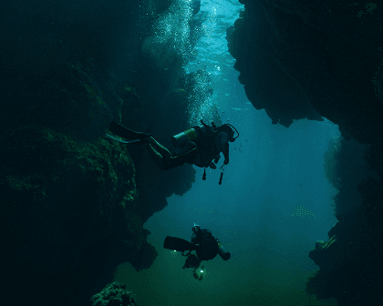Scuba divers exploring a reef